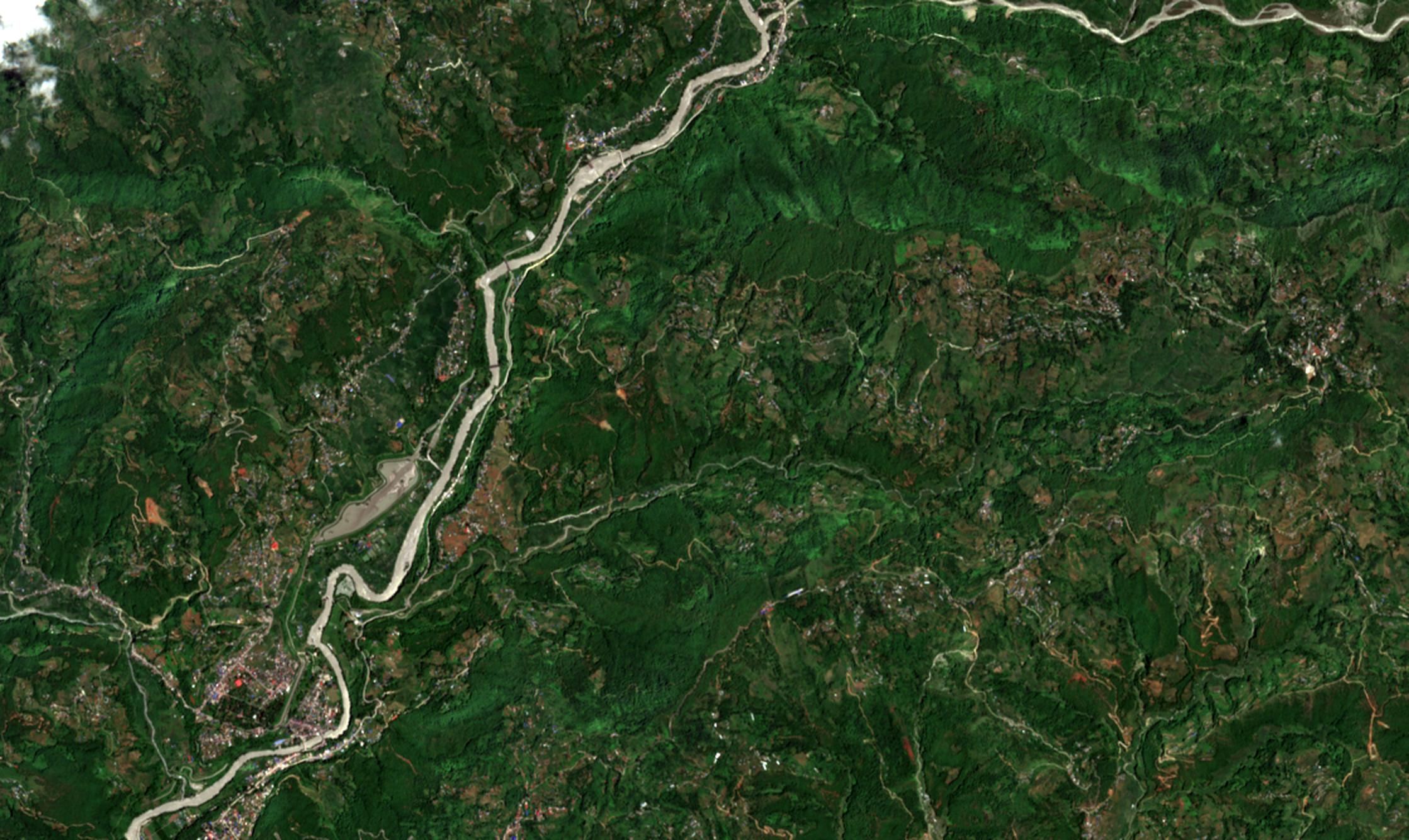 The Trishuli at Bidur on 12 August 2026: a narrow river between green terraces.